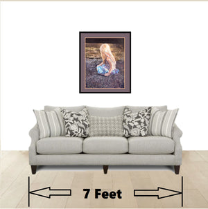 Beautiful framed fairy wall art print in living room above a couch